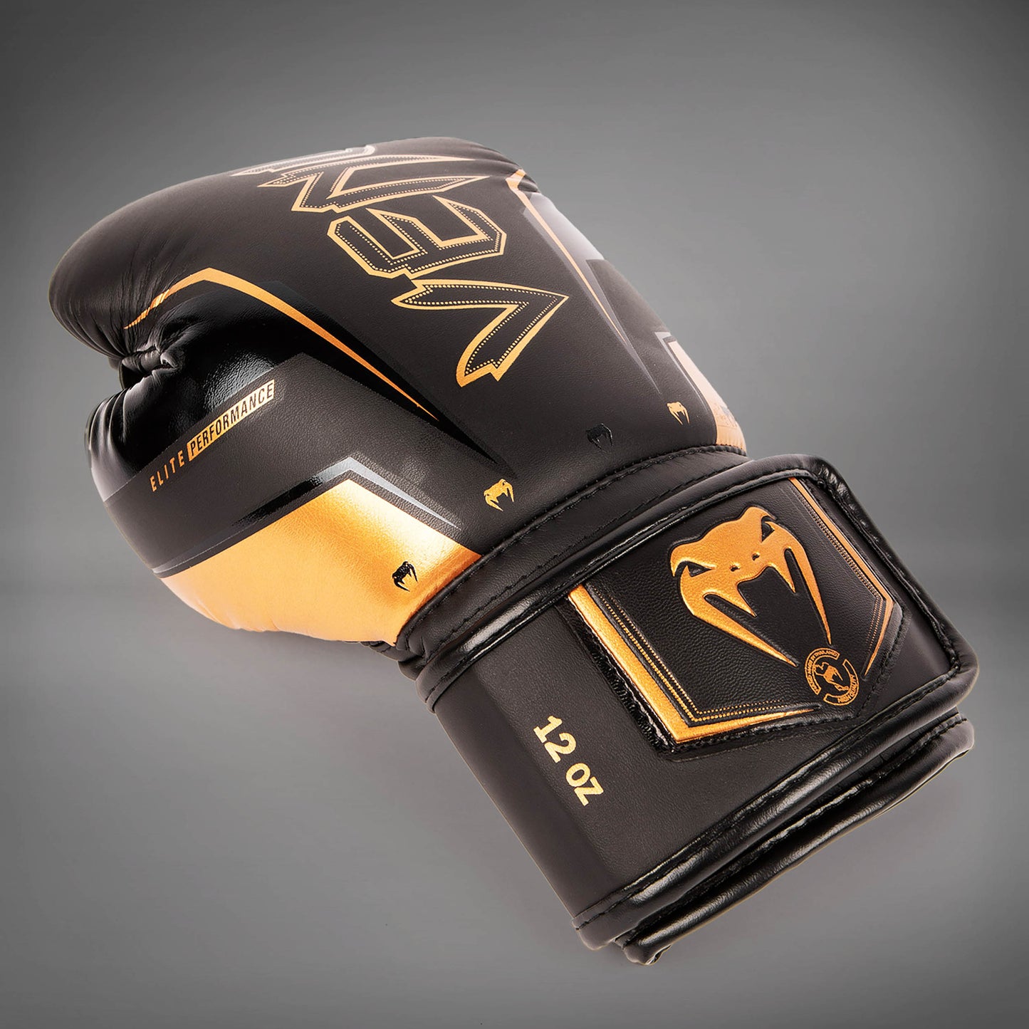 Venum Elite Evo 拳击手套 – 黑色/青铜色